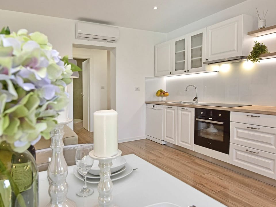 Cabinetry, Property, Furniture, Countertop, White, Interior Design, Plant, Kitchen Appliance, Kitchen Stove, Drawer