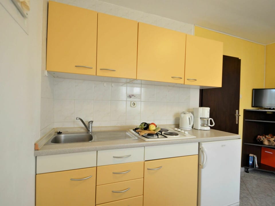Cabinetry, Countertop, Property, Building, Kitchen Sink, Sink, Drawer, Kitchen Appliance, Kitchen Stove, Kitchen