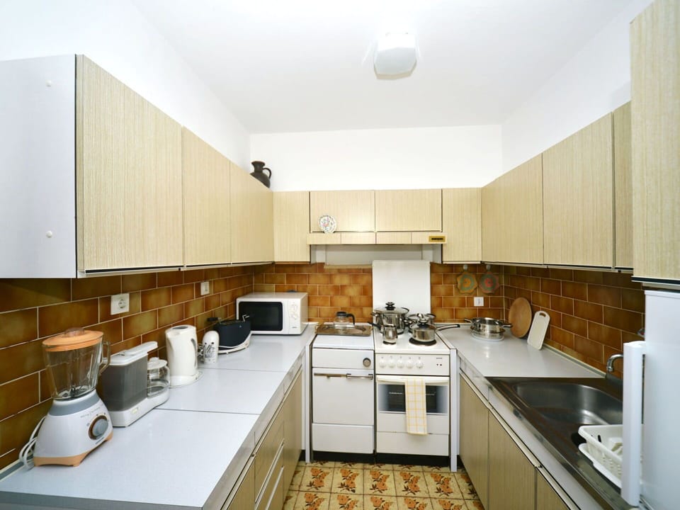 Cabinetry, Property, Countertop, Building, Kitchen Appliance, Kitchen Stove, Kitchen, Wood, Sink, Interior Design