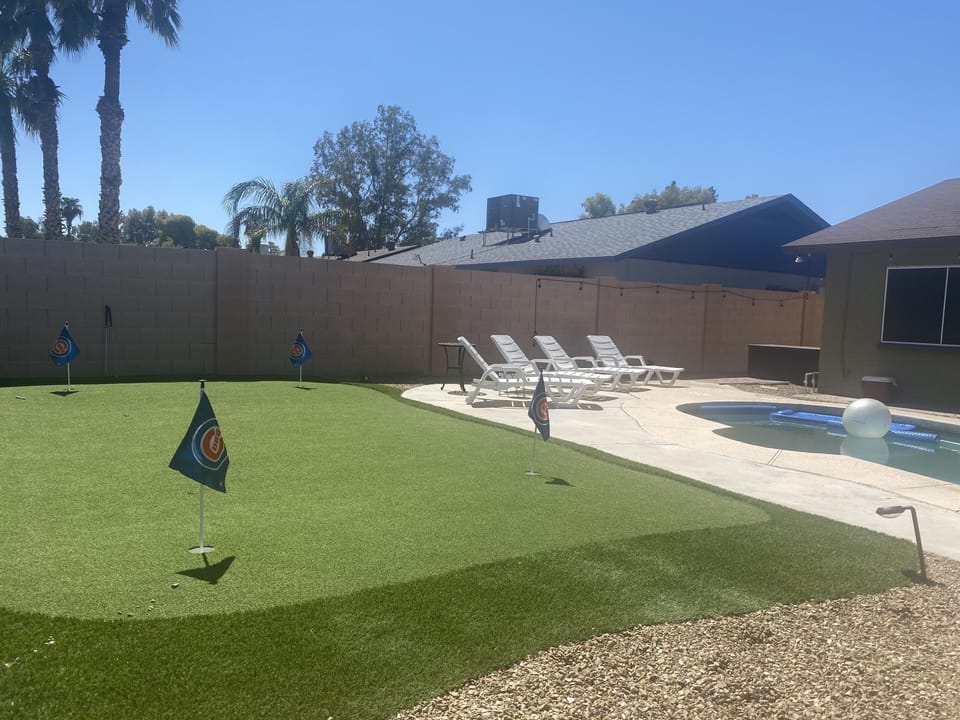 Putting green and a view of the pool and loungers!
