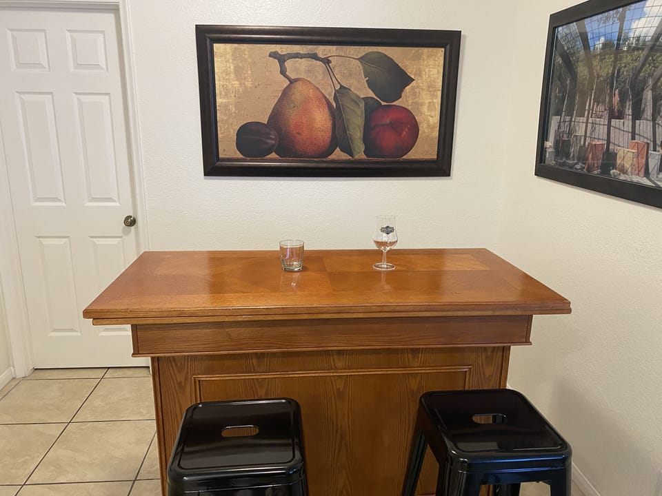 Dining room area has a tall bar that sits 6 comfortably.