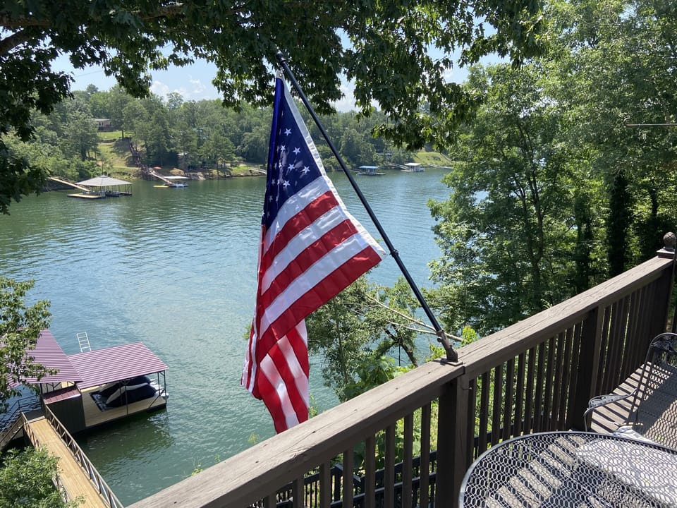 Top Deck with Patio table and 6 chairs.  Overlooking Smith Lake and Dock.