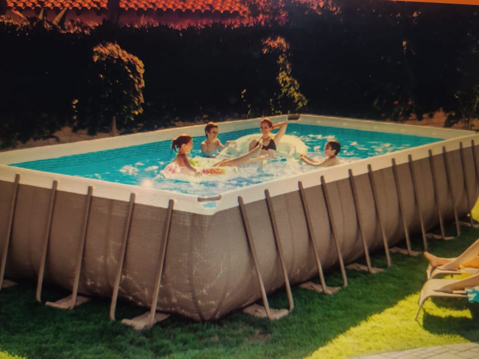 A swiimming pool like in the photo will be available  from May till September