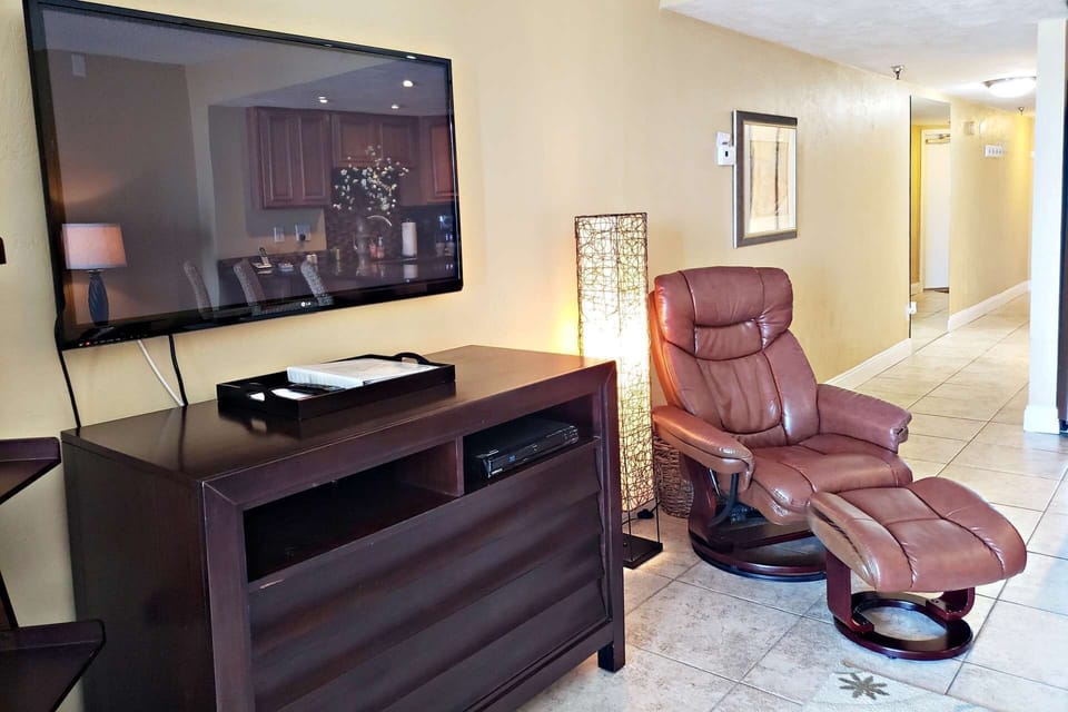 In addition, living room features a fifty-one inch flat screen cable TV, Blue Ray DVD and WiFi.