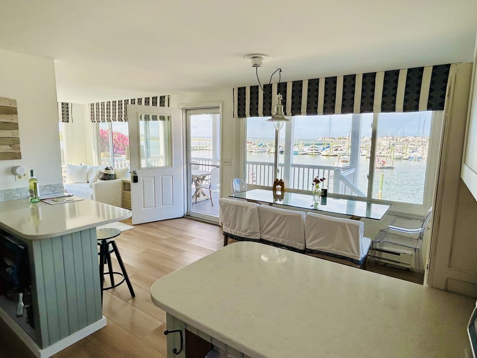 View from the kitchen. Dining table seats 6-8 and 4 stools at the peninsula 