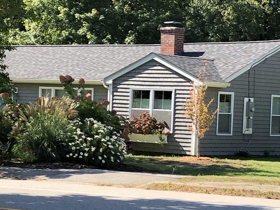 The beautifully landscaped yard is a welcoming feature of our home. 