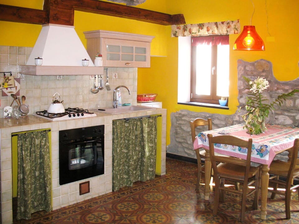 Room, Kitchen, Property, Furniture, Countertop, Interior Design, Yellow, Building, Cabinetry, House
