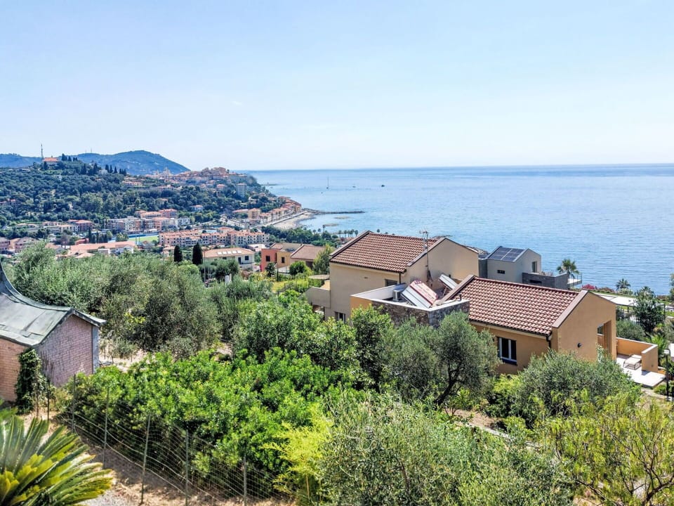 Blue, Residential Area, Coast, House, Sea, Home, Coastal And Oceanic Landforms, Roof, Human Settlement, Ocean