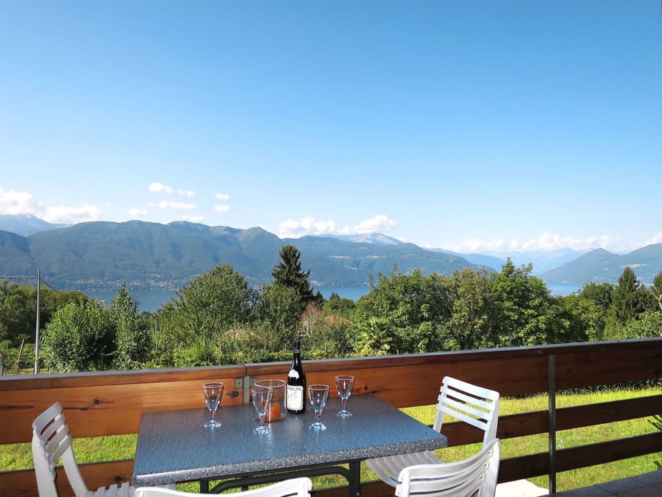 Sky, Table, Cloud, Furniture, Property, Mountain, Chair, Tableware, Outdoor Furniture, Tree