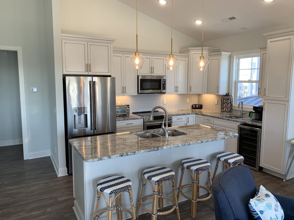Open kitchen with high end appliances, 2 sinks and separate beverage fridge