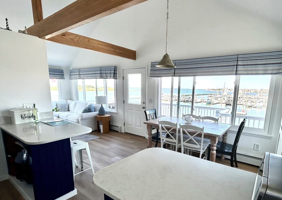 Island and dining table seating with stunning bay views