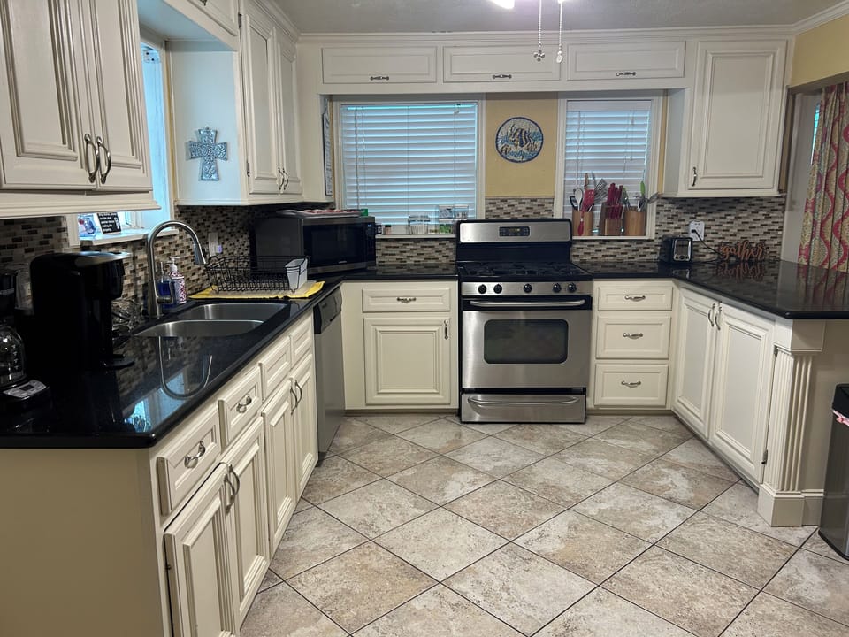 Kitchen has full size stove, dishwasher, microwave and frig.