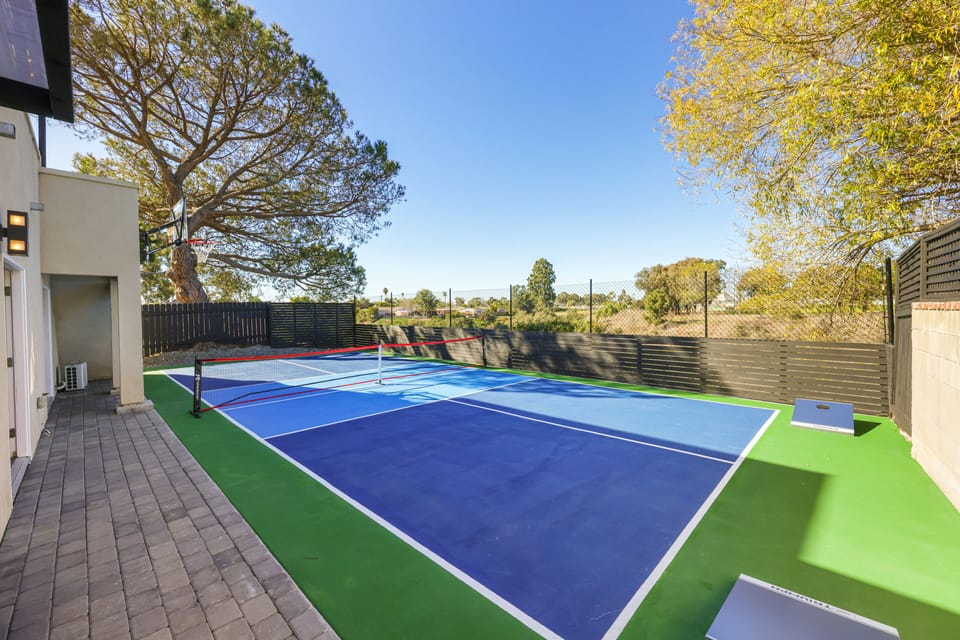 Full-size pickleball court and a versatile basketball hoop.