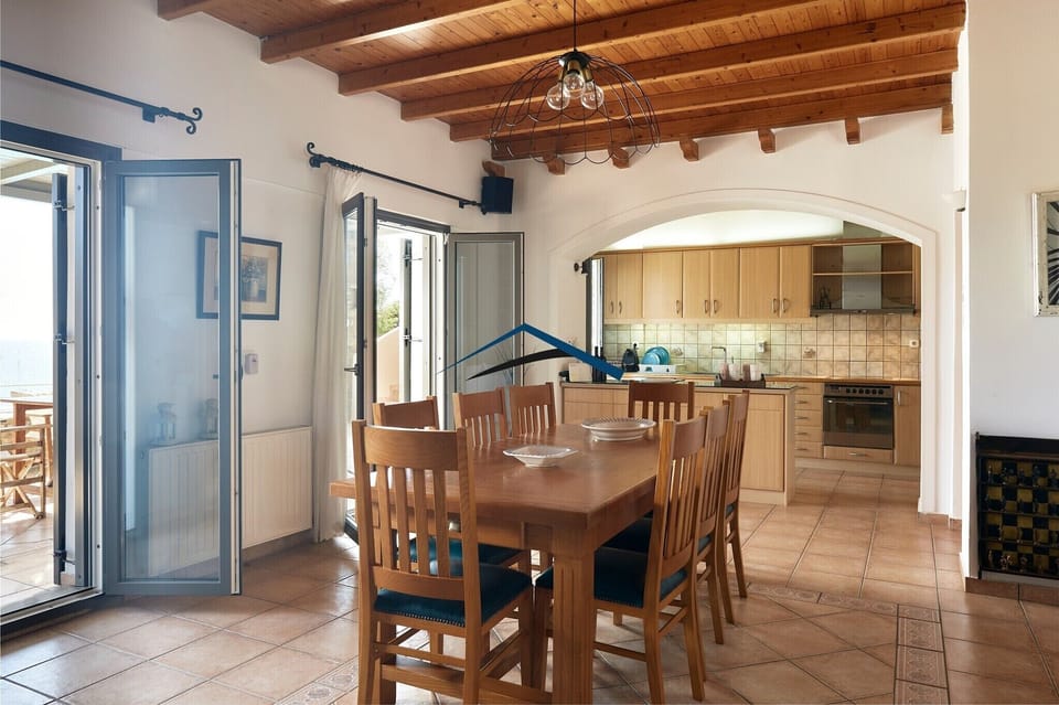 The dining area and the fully equipped kitchen