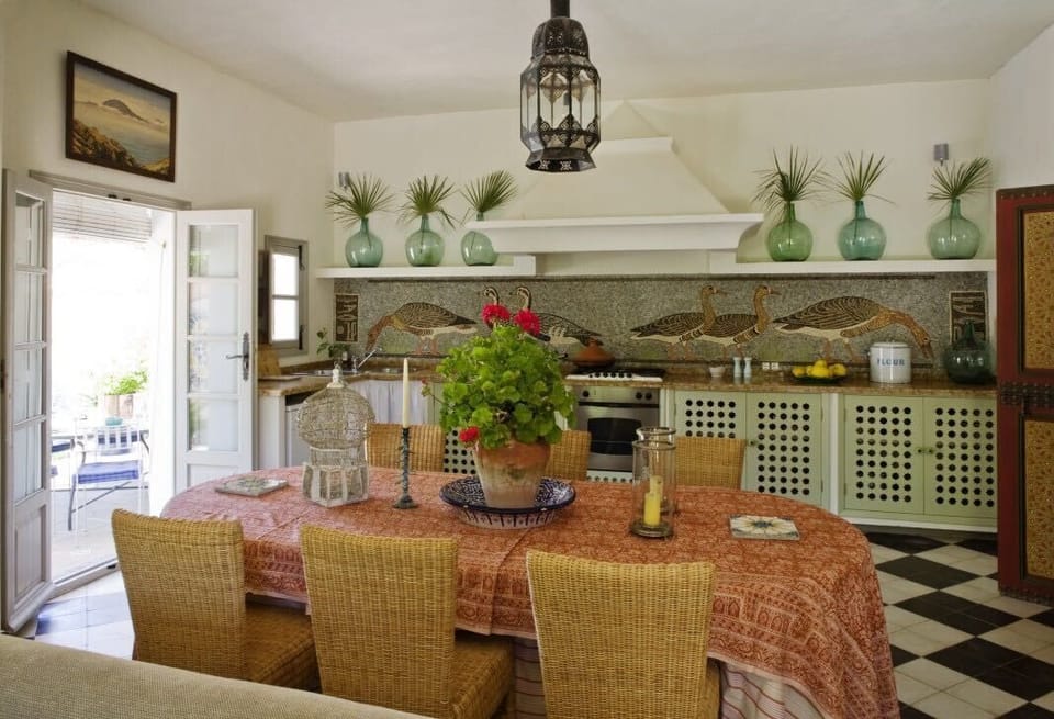 The Apartment kitchen and dining table, before the new white floor.