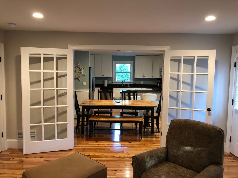 French Doors from the family room leading into the dining area and kitchen.