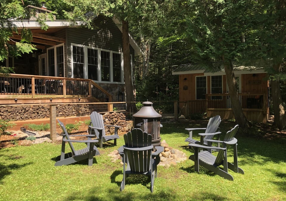 Cottage, firepit, and Guest Cabin..