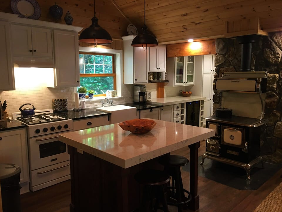 Kitchen looking into the pantry behind the Elmira wood stove.