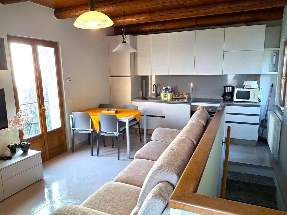 Furniture, Interior Design, Flooring, Wood, Floor, Room, Living Room, Couch, Lighting, Table