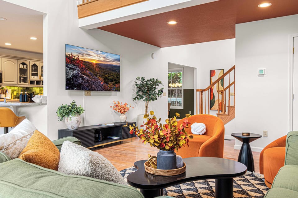 [Living Room] A cozy and well-lit space for your group to gather around and watch your favorite shows.