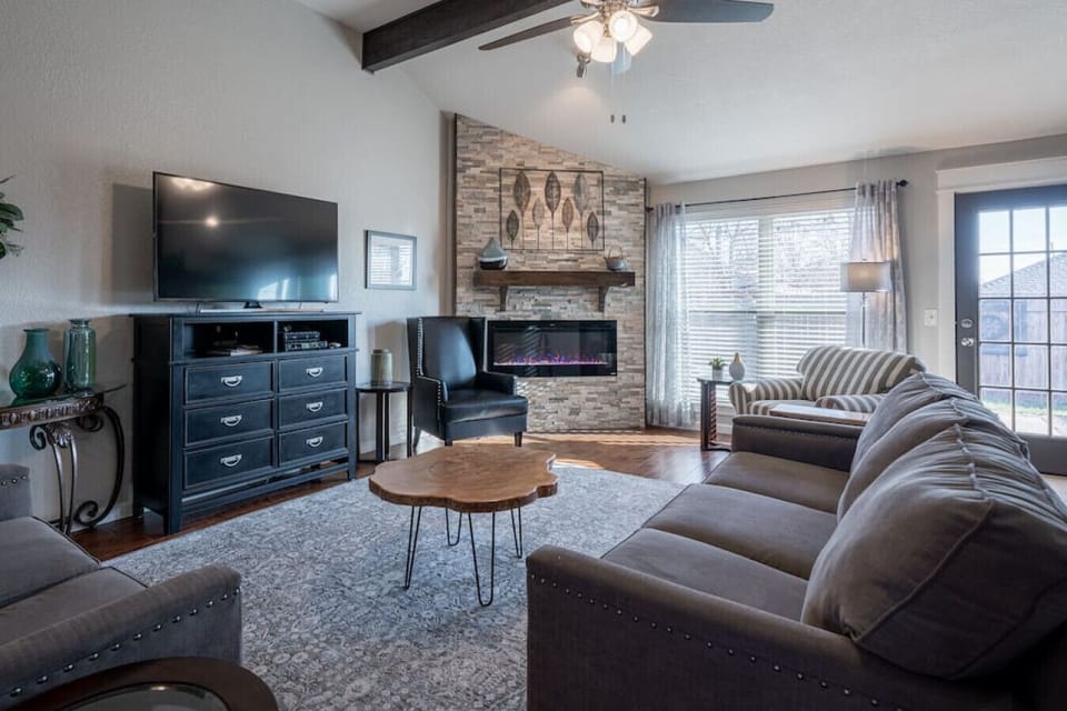 Open living space with fireplace and plenty of natural light