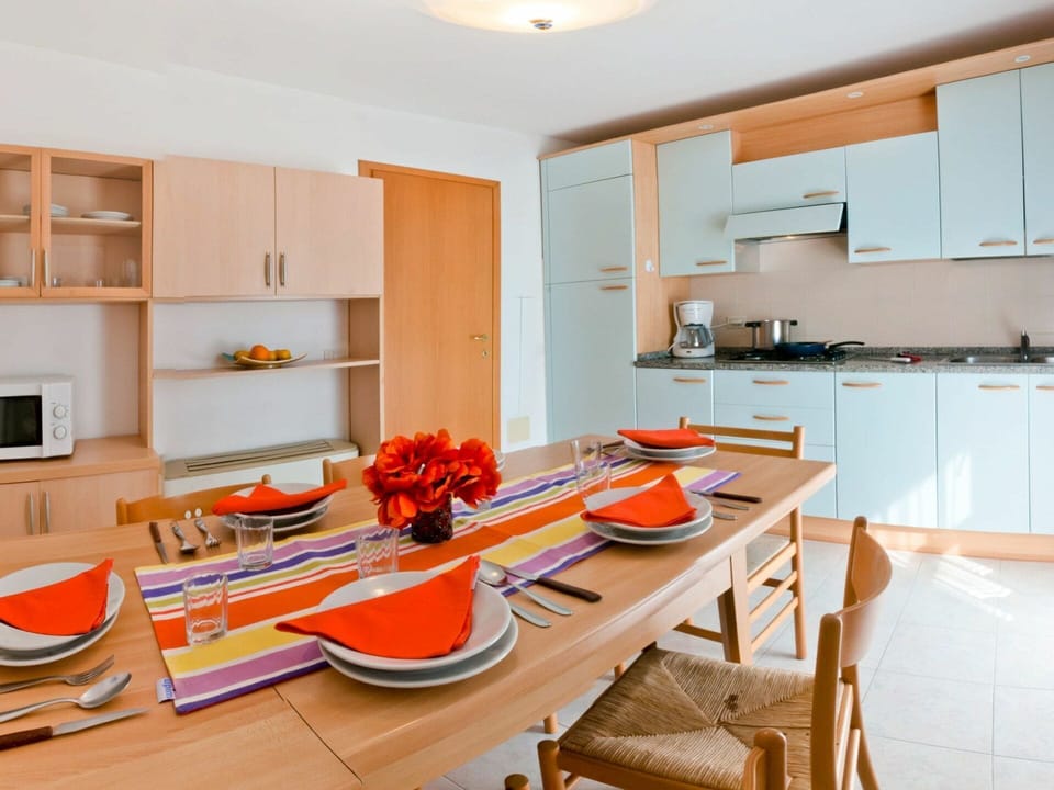 Room, Furniture, Kitchen, Property, Interior Design, Orange, Countertop, Building, Yellow, Table