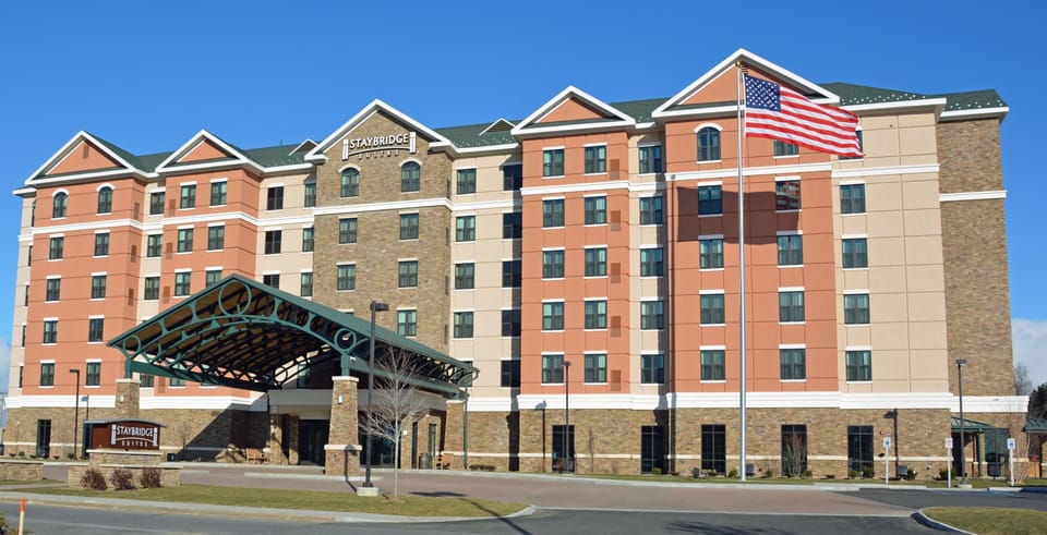 Exterior view showcasing a flag and welcoming architecture.