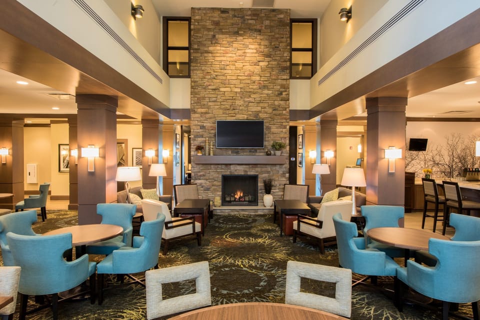 Communal lounge with fireplace and comfortable seating.