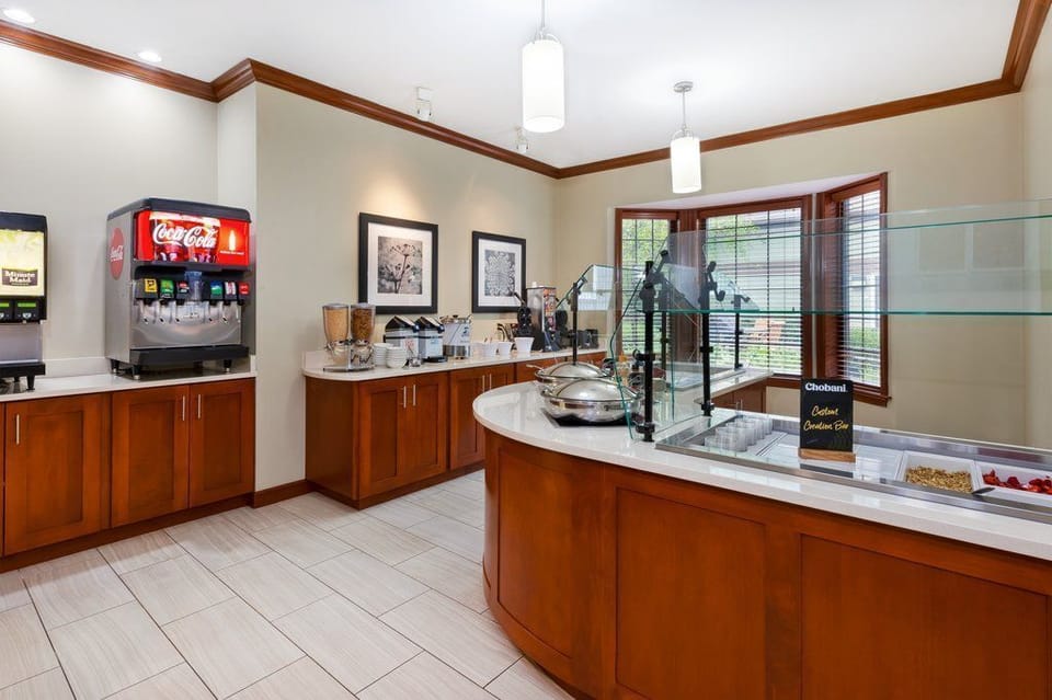 Start your day with a variety of breakfast options set in a bright and inviting atmosphere.