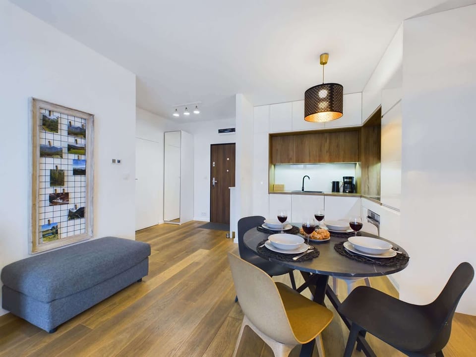Large table with chairs for eating communal meals. 