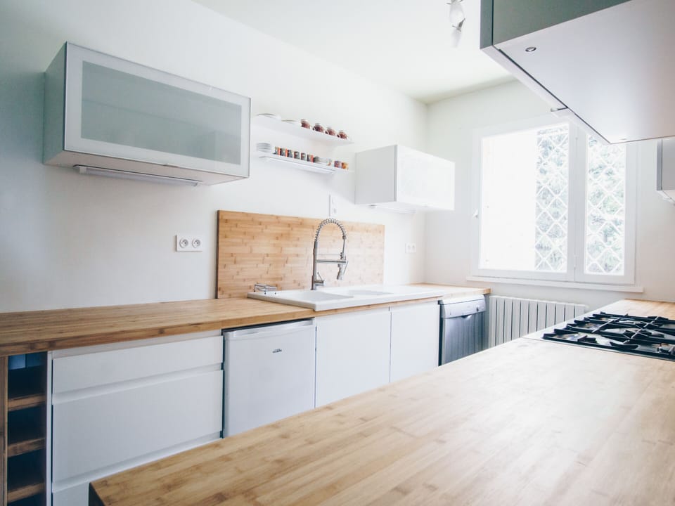 Fully-equipped kitchen with a gas stove 