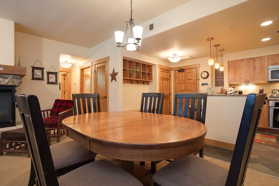 Gather around this spacious dining table where your group can share meals and create memories in the warm, rustic atmosphere.
