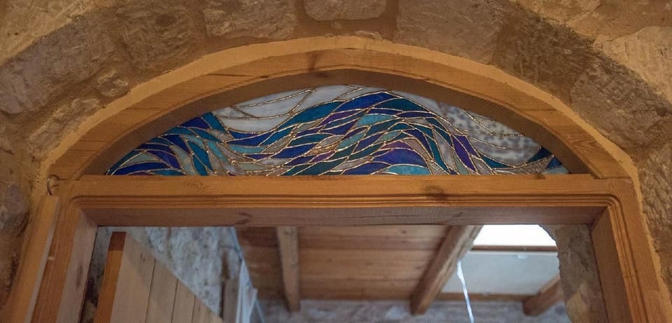 Door case with ornaments made of glass