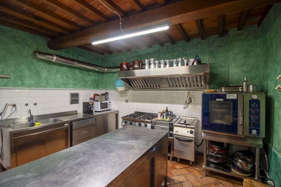 Kitchen, Countertop, Kitchen Appliance, Interior Design, Flooring, Ceiling, Lighting, Furniture, Major Appliance, Kitchen Stove