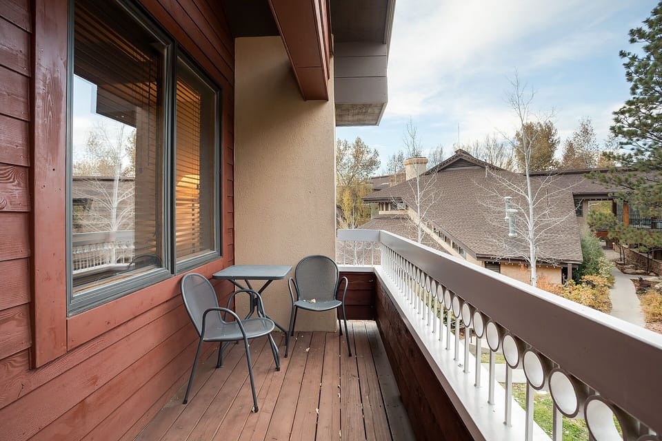 Step onto your private balcony and breathe in the fresh mountain air while enjoying peaceful neighborhood views from your cozy outdoor retreat.