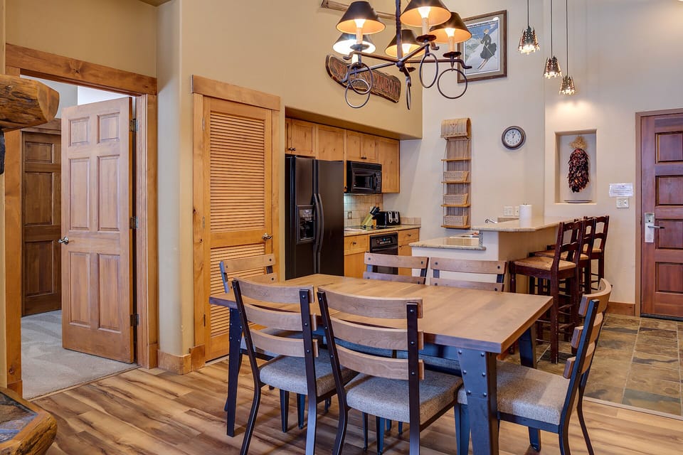 Your spacious kitchen and dining area blends rustic charm with modern convenience, perfect for family meals and vacation memories.
