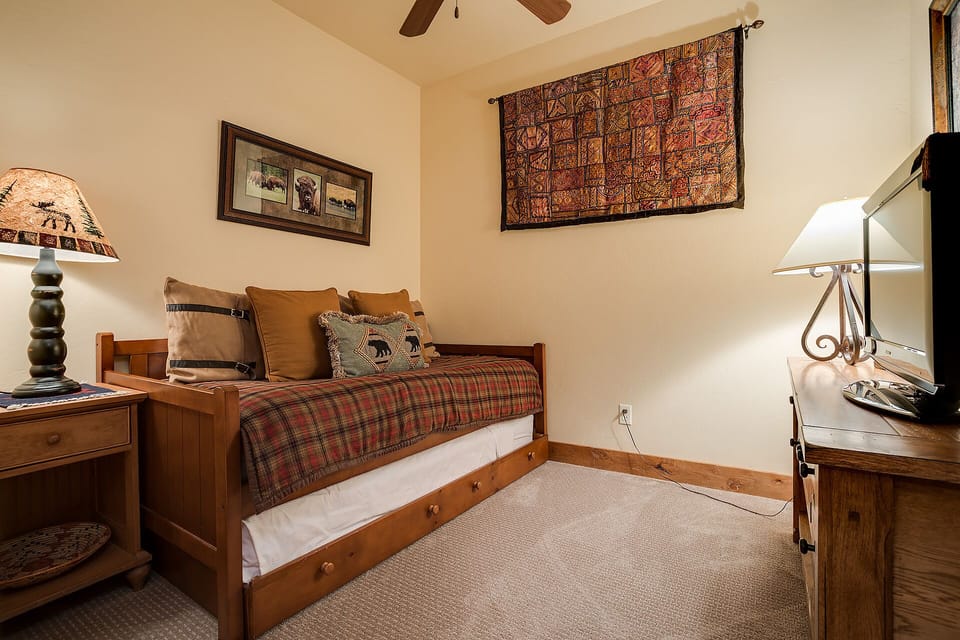 Drift off in your cozy rustic bedroom, complete with warm wood furnishings and charming lodge-inspired decor.