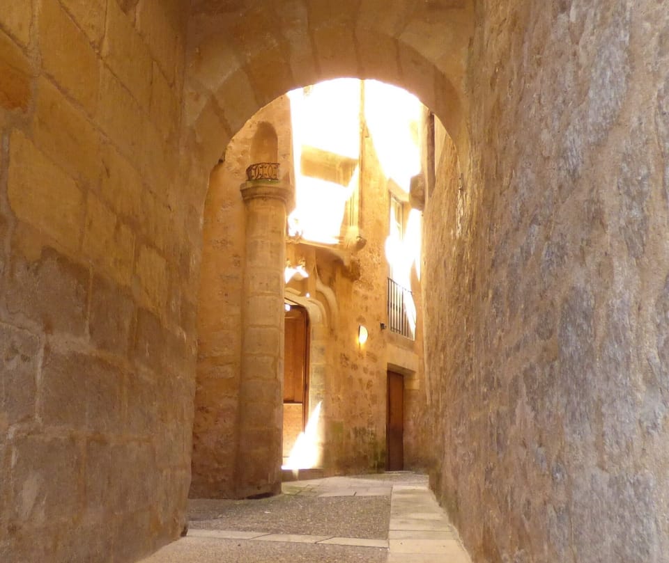 Enter through the medieval courtyard