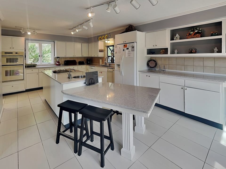 Fully Equipped Kitchen with a Breakfast Bar for Seating for Two