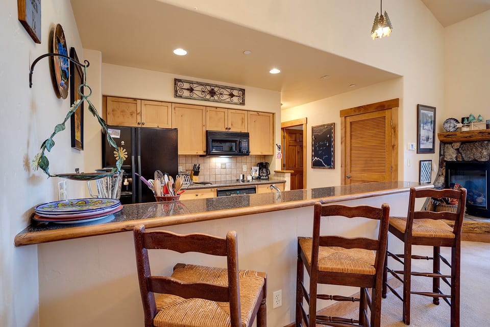 Your open kitchen flows seamlessly into the living area, perfect for gathering while preparing meals on granite counters.