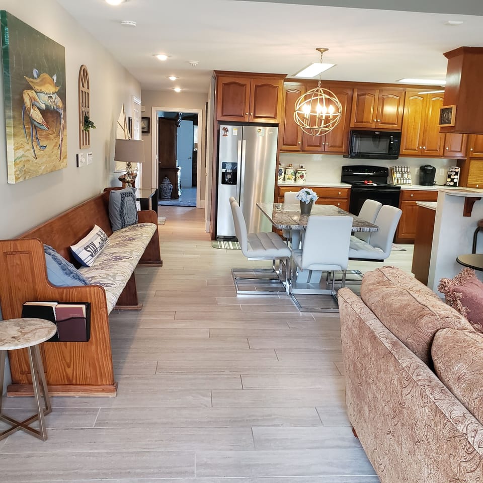 View from front door through main hallway to Primary Bedroom.