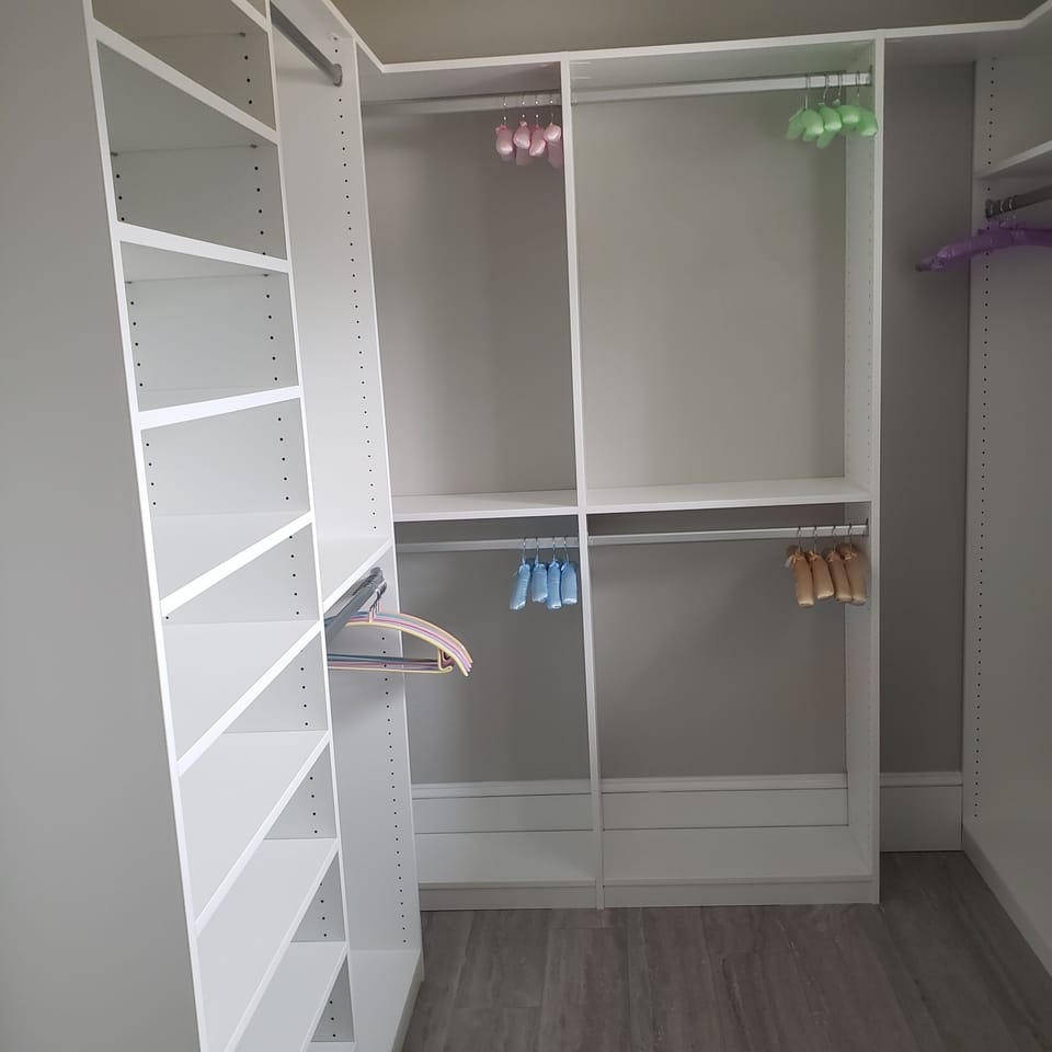 Custom closet in Primary bedroom.