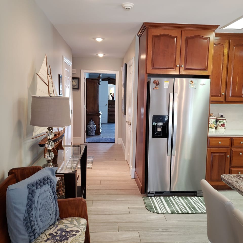 Stainless steel side by side refrigerator in main kitchen.