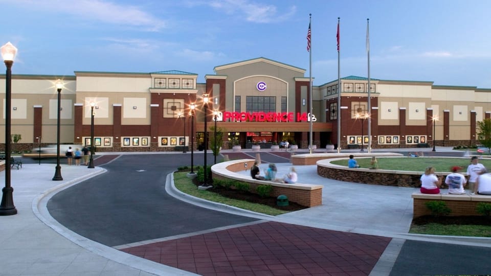 Building exterior with outdoor seating area.