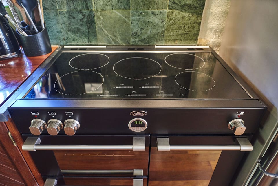 state of the art European double oven as well as induction touch screen cooktop.