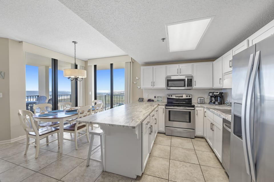 Full Kitchen with Granite Countertops, Stainless Steel Appliances and additional Seating at the Breakfast Bar
