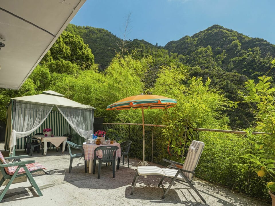 Plant, Sky, Table, Shade, Umbrella, Tent, Mountain, Outdoor Furniture, Tree, Outdoor Table