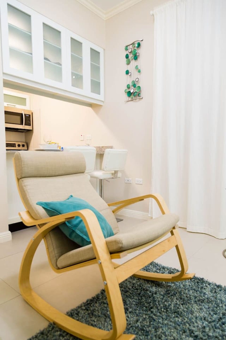 Comfortable lounge chair w/ soft cushions, perfect for reading or relaxing indoors.