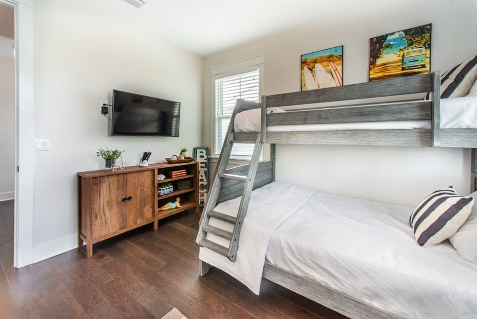 Bunk room with flat screen TV