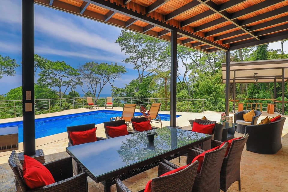 Outdoor covered dining - table seats 8; lounge area 4 more; bar seats 6